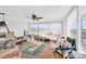 Sunroom with many windows, wood floor, and ceiling fan at 45 Sunderland Rd, Concord, NC 28027