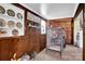 Sunroom with wood paneling, brick fireplace, and birdcage at 45 Sunderland Rd, Concord, NC 28027