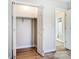 Well-lit bedroom closet with shelving and access to the bathroom at 602 Helms Dr, Lowell, NC 28098