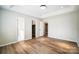 Bright bedroom with vinyl flooring and access to bathroom and closet at 602 Helms Dr, Lowell, NC 28098