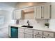 Modern kitchen features white cabinets, a teal dishwasher, and subway tile backsplash at 602 Helms Dr, Lowell, NC 28098