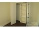 Open closet with built-in shelves and white doors in a bedroom at 615 E Ridge Rd, Salisbury, NC 28144