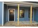 Inviting front entrance with a black door and covered porch at 635 E Ridge Rd, Salisbury, NC 28144