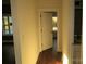 Bright hallway with dark hardwood floors and an open door at 635 E Ridge Rd, Salisbury, NC 28144