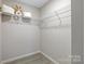 Walk-in closet with wire shelving for ample storage at 7 Riverside St, Lowell, NC 28098