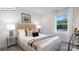 Another view of a bedroom featuring a neutral color scheme, modern bed, and window at 108 Rustling Waters Dr, Mooresville, NC 28117