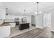 Modern kitchen with island, stainless steel appliances, and granite counters at 10859 Garden Oaks Ln, Charlotte, NC 28273