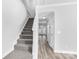 Gray carpeted staircase leading to the upper level of the home at 10859 Garden Oaks Ln, Charlotte, NC 28273