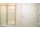 Bathroom with a glass shower enclosure, white fixtures, and neutral walls at 110 Windstone Common Ln, Mooresville, NC 28117