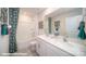 Bathroom with double vanity, shower/tub combo, and decorative shower curtain at 110 Windstone Common Ln, Mooresville, NC 28117