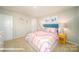 bedroom with pink and rainbow decor, white furniture, and plush carpeting at 110 Windstone Common Ln, Mooresville, NC 28117