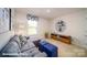 Bonus room with plush carpet, sectional sofa, and built-in shelving at 110 Windstone Common Ln, Mooresville, NC 28117