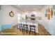 Kitchen with white cabinets, granite counters, stainless appliances, and breakfast bar at 110 Windstone Common Ln, Mooresville, NC 28117