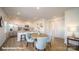Modern kitchen and dining area with white cabinetry, stainless steel appliances, and island at 110 Windstone Common Ln, Mooresville, NC 28117