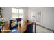 Home office featuring two desks, ample natural light, and stylish rug at 110 Windstone Common Ln, Mooresville, NC 28117