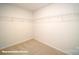 Large walk-in closet with ample shelving for storage at 110 Windstone Common Ln, Mooresville, NC 28117