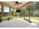 Relaxing screened porch with a view of the backyard and ceiling fan at 1218 Kings Grove Dr, York, SC 29745