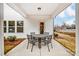 Covered patio with a round table and four chairs, ideal for outdoor relaxation at 122 Shay Crossing Rd, Salisbury, NC 28146