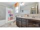 ' bathroom featuring double vanities, a bathtub, and decorative shower curtain at 122 Shay Crossing Rd, Salisbury, NC 28146