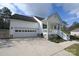 White house with a green accented porch and a spacious driveway at 1274 Bicycle Ct, York, SC 29745