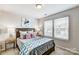 Secondary bedroom with two windows and modern decor at 2735 Texana Ct, Charlotte, NC 28269
