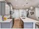 Kitchen with stainless steel appliances, white countertops, and herringbone backsplash at 2735 Texana Ct, Charlotte, NC 28269