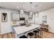 Modern kitchen with gray cabinets, white countertops, and island with bar seating at 2735 Texana Ct, Charlotte, NC 28269