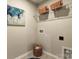 Laundry room with wire shelving, washer/dryer hookups, and storage baskets at 2735 Texana Ct, Charlotte, NC 28269
