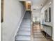 Carpeted staircase with wooden railing leading to the second floor at 2735 Texana Ct, Charlotte, NC 28269