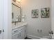 Modern bathroom with white cabinets and a large mirror at 3030 Constitution Ln # 13, Gastonia, NC 28056