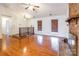 Spacious living area with hardwood floors and raised hearth at 3552 Braewick Pl, Charlotte, NC 28227