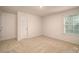 Empty bedroom with neutral carpet and large window at 521 Zermatt Ct, Monroe, NC 28112