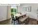 Dining area with a wooden table, chairs, and sliding glass doors to the backyard at 529 Zermatt Ct, Monroe, NC 28112