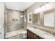 Modern bathroom with a walk-in tiled shower, double vanity and granite counters at 8695 Freeze Rd, Kannapolis, NC 28081