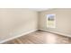 Empty bedroom with light wood-look floors and a large window at 8695 Freeze Rd, Kannapolis, NC 28081