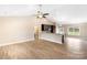 Open-concept living room and kitchen area with vaulted ceilings and wood-look flooring at 8695 Freeze Rd, Kannapolis, NC 28081