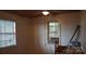 Simple bedroom with window and AC unit at 111 River Ridge Trl, Mount Gilead, NC 27306