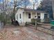 House with a driveway and small yard at 1416 N Davidson St, Charlotte, NC 28206