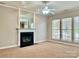 Living room featuring a fireplace, ceiling fan, and ample natural light at 2001 Sentinel Dr, Indian Trail, NC 28079