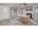 Dining room featuring a fireplace, large windows, and access to the front door at 2351 Walker Rd, Mount Pleasant, NC 28124