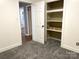 Bedroom with grey carpet and built-in shelving at 3295 Cimmeron Rd, Lancaster, SC 29720