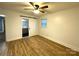 Bedroom with wood flooring, barn door, and en-suite bathroom at 3295 Cimmeron Rd, Lancaster, SC 29720