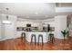 Modern kitchen with white cabinets, granite counters, and island at 335 Blume Rd, Mooresville, NC 28117