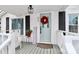 Inviting front porch with white railing and a blue door at 353 Lee St, Mooresville, NC 28115