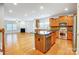 Kitchen with an island, stainless steel appliances, and hardwood floors at 3642 Savannah Hills Dr, Matthews, NC 28105