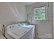 Laundry room with washer and dryer, and window at 402 E Arch St, Lancaster, SC 29720