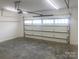 Spacious garage interior with white walls and garage door at 4033 Stadler Ne Dr # 22, Conover, NC 28613