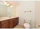 Bathroom features a vanity, toilet, and mirror at 4709 Polo Gate Blvd, Charlotte, NC 28216