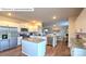 Modern kitchen with island, stainless steel appliances, and view of the living room at 533 Zermatt Ct, Monroe, NC 28112