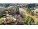 Aerial view of lakefront property with numerous homes and lush trees at 60 Sigmon Drum Rd, Hickory, NC 28601
